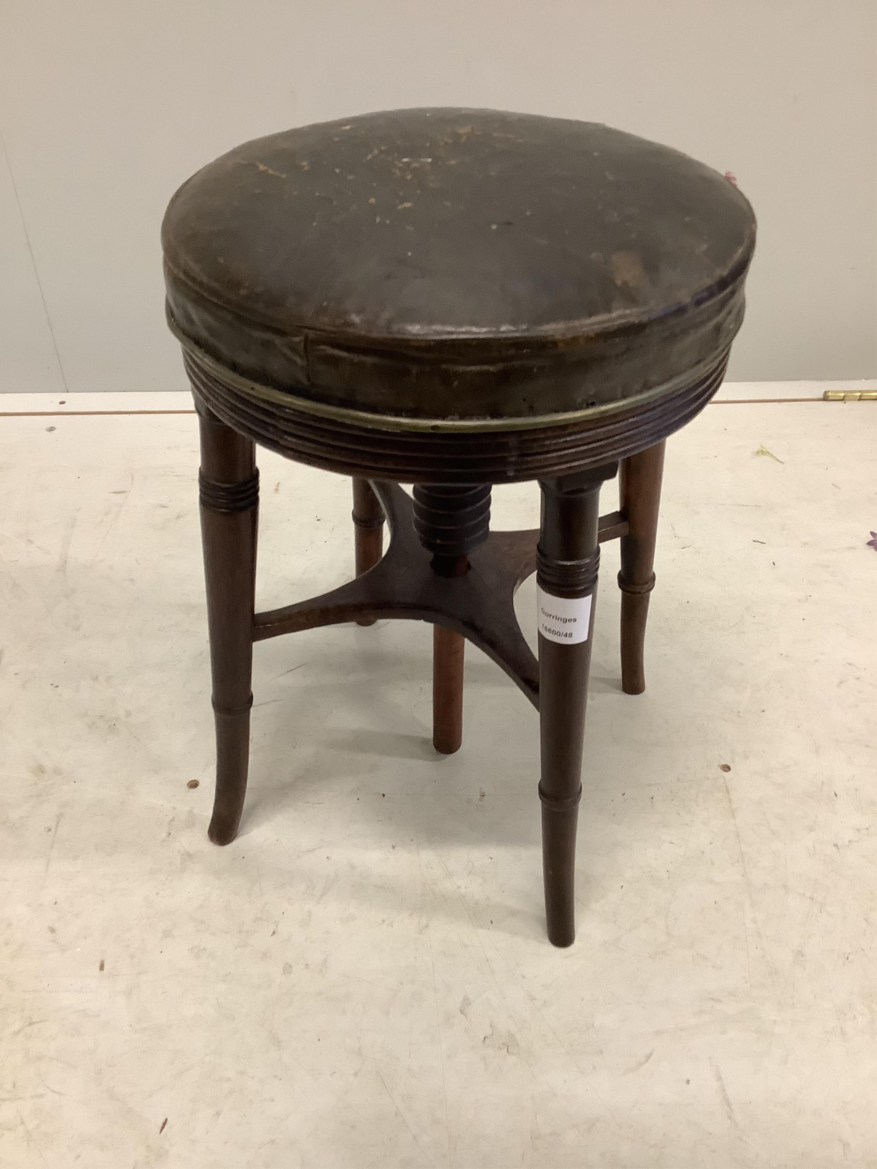 A Regency mahogany circular adjustable piano stool and a Victorian beech and cast iron piano stool. Condition - poor to fair